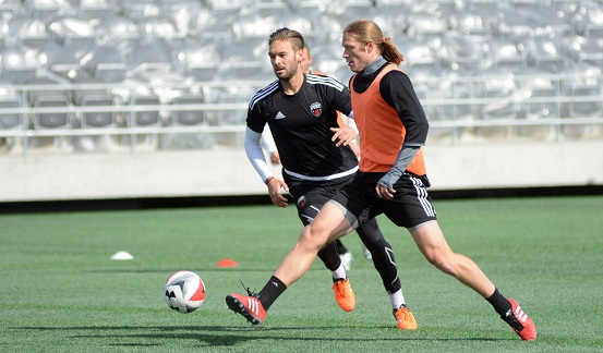 James (in black) and Fury FC teammate Lance Rozeboom train at TD Place on Wednesday, March 30, 2016. Photo: Chris Hofley/Ottawa Fury FC