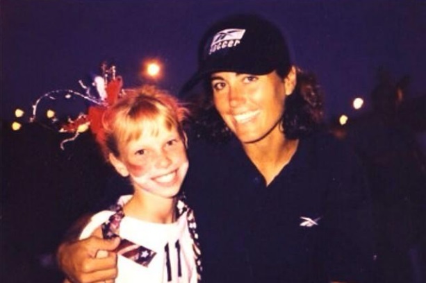 A childhood Michelle meeting USWNT legend Julie Foudy. Photo: Michelle Lomnicki